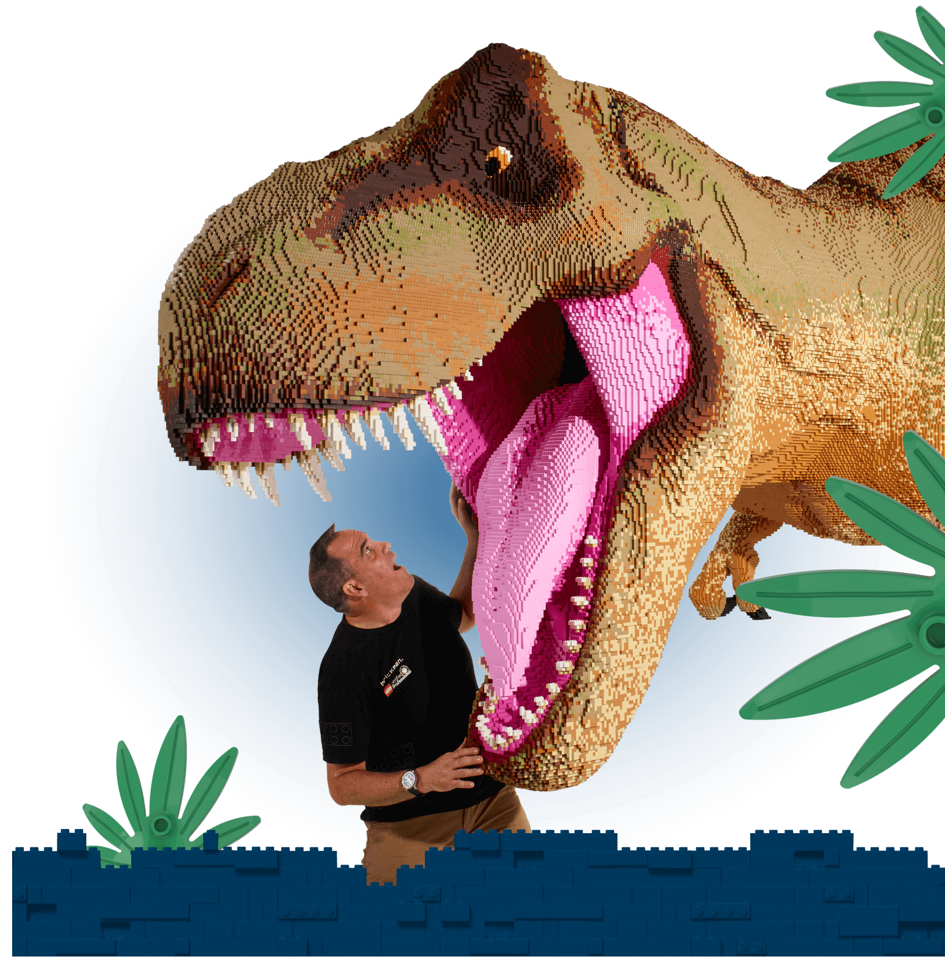 Ryan and a massive T-Rex at Jurassic World by Brickman.